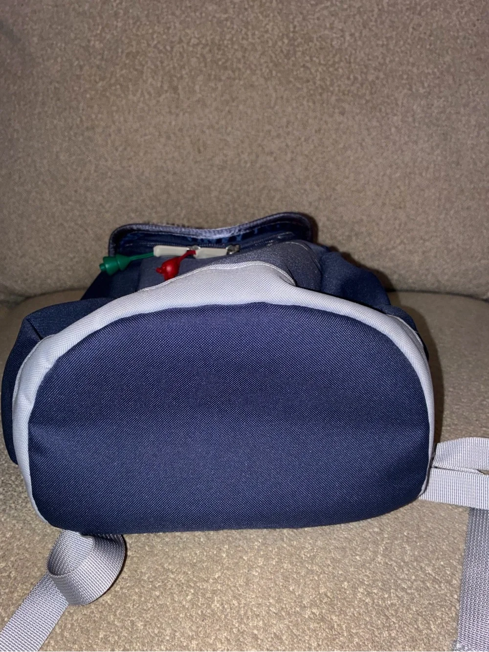The North Face Kids Navy and Light Gray Backpack with Red & Green Pulls